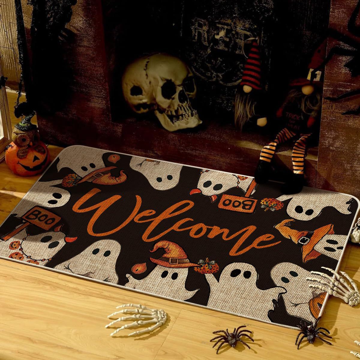 Halloween-themed doormat with ghosts, pumpkins, and text on a wooden floor.