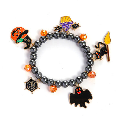 Halloween-themed bracelet with various charms on a white background