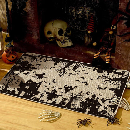 A rectangular Halloween-themed rug with a black and off-white spooky print featuring haunted houses, bats, trees, and a full moon, styled on a wooden floor with seasonal props including a skull, gnomes, spiders, and skeleton hands.