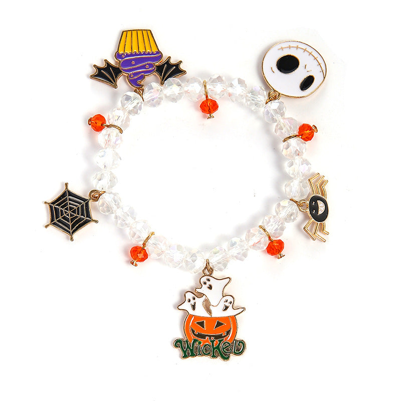 Halloween-themed bracelet with various charms on a white background