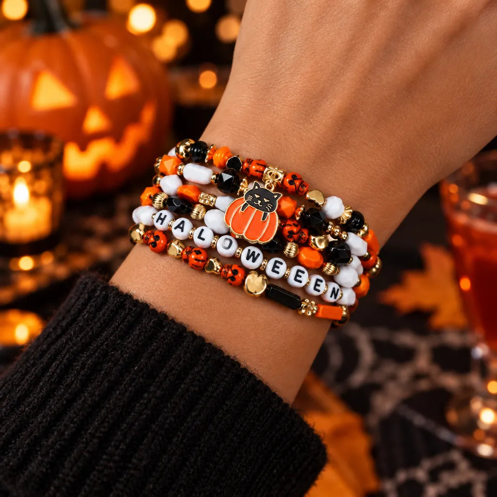 Spooky charm Halloween beaded bracelet – pumpkin, ghost and skull pendant jewelry